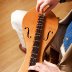 Dan Evans playing dulcimer from above