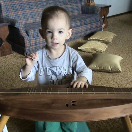 Owen playing dulcimer