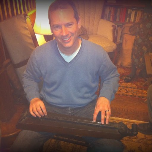 Me playing a mid-1800s dulcimer
