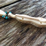 Carved bone dulcimer pendent