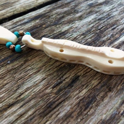 Carved bone dulcimer pendent