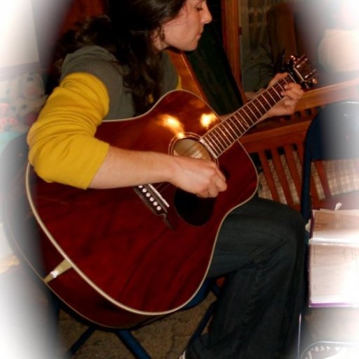 Singing, strumming, visiting Sarah