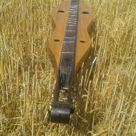 Poplar dulcimer on whole wheat... stubble.