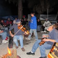 Michael Vickey and Matt Miller jam around the campfire.